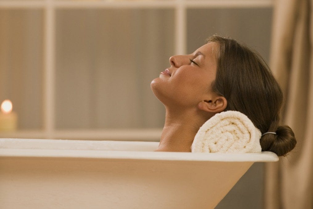 Woman soaking in bathtub