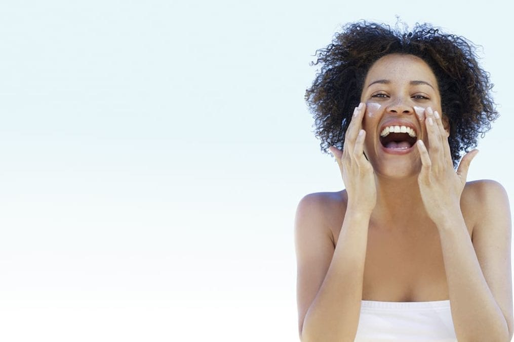 skincare - woman cleansing face