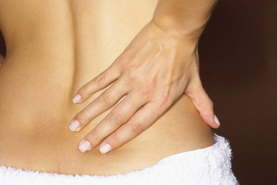 woman with palm on bare back