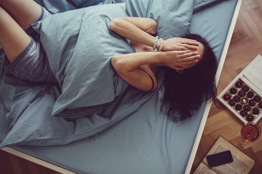 Girl crying in bed