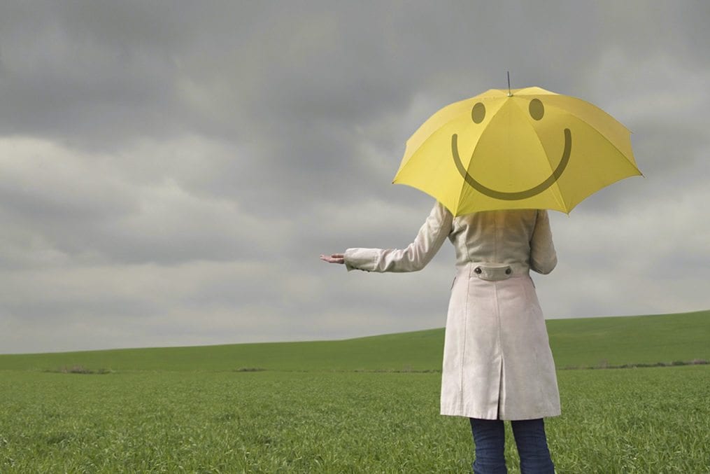blue monday - woman holding umbrella