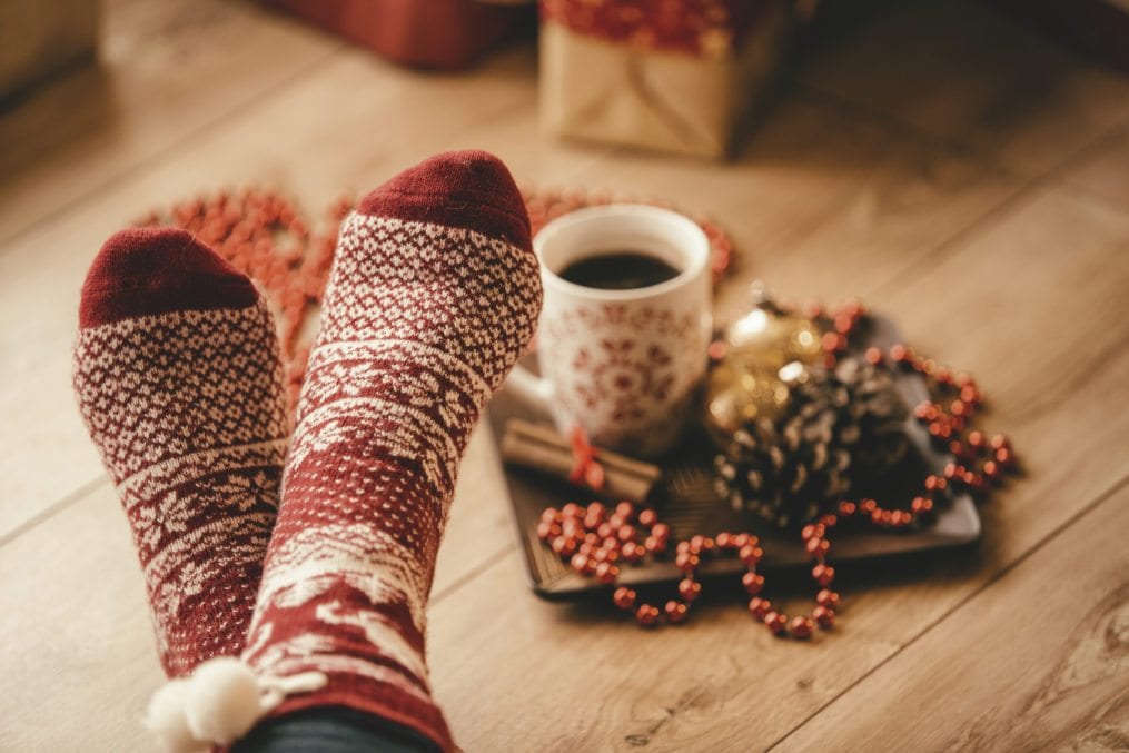 Crossed legs in seasonal winter socks