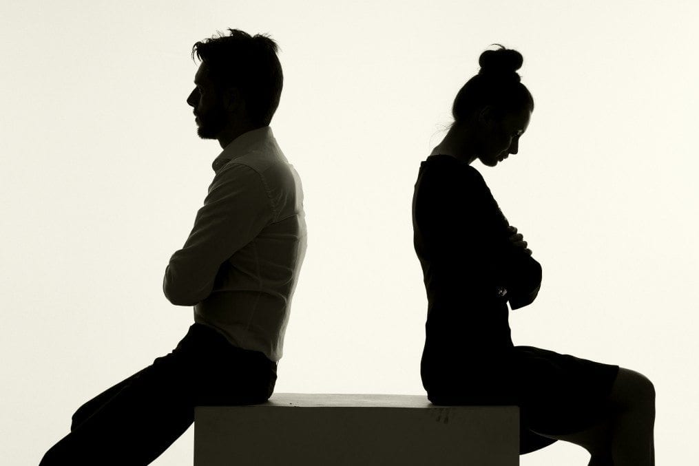 couple with backs turned to each other