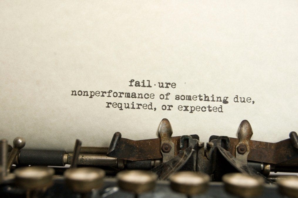 Failure written on paper of typewriter