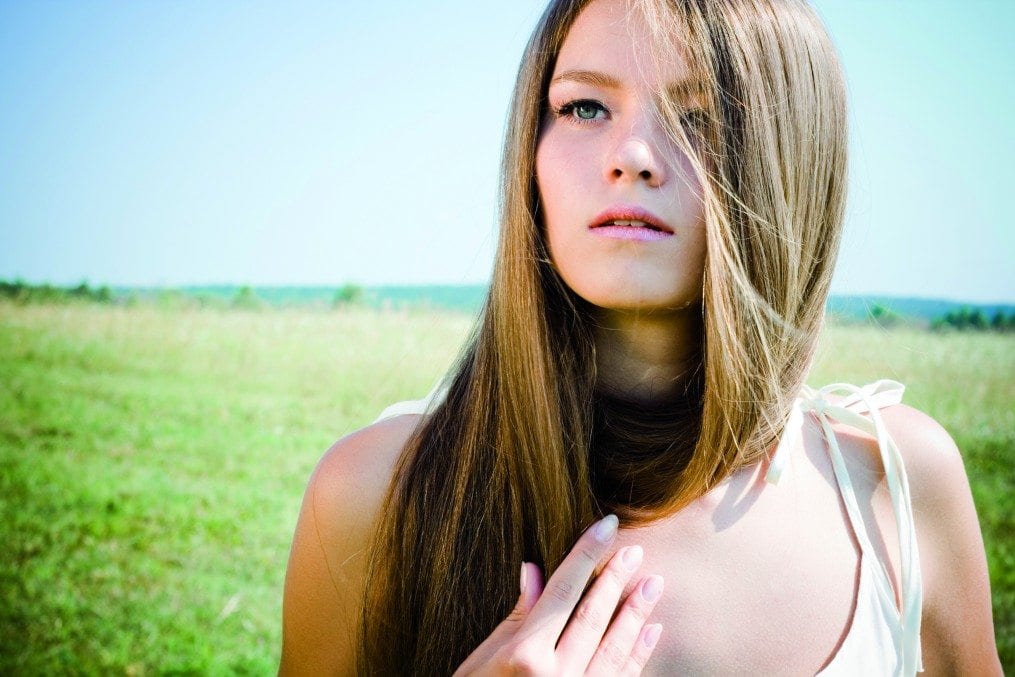 Beautiful girl with luxuriant hair outdoor