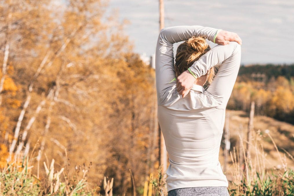 Woman stretching her back