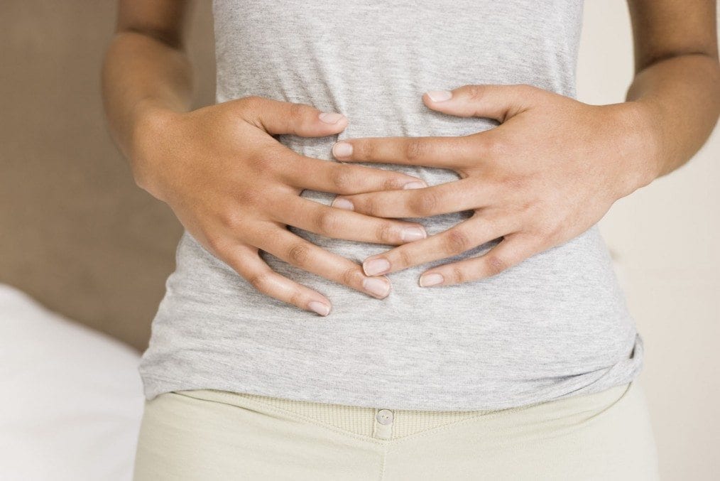 Woman holding stomach