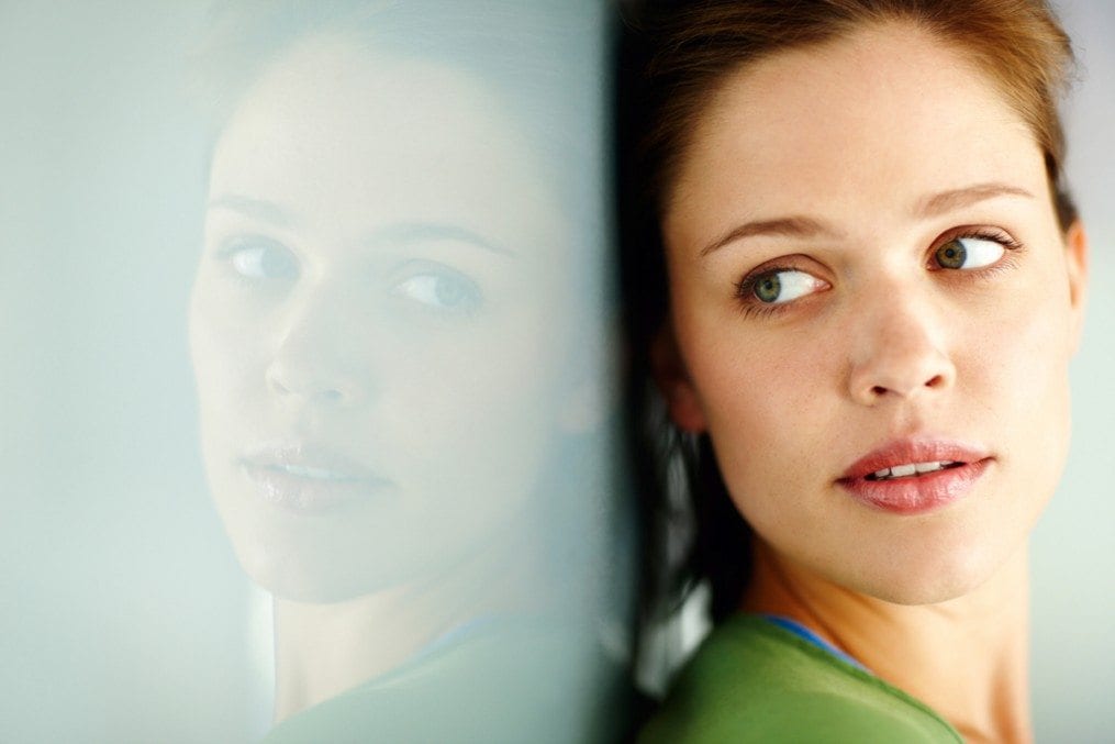 Woman looking at her reflection