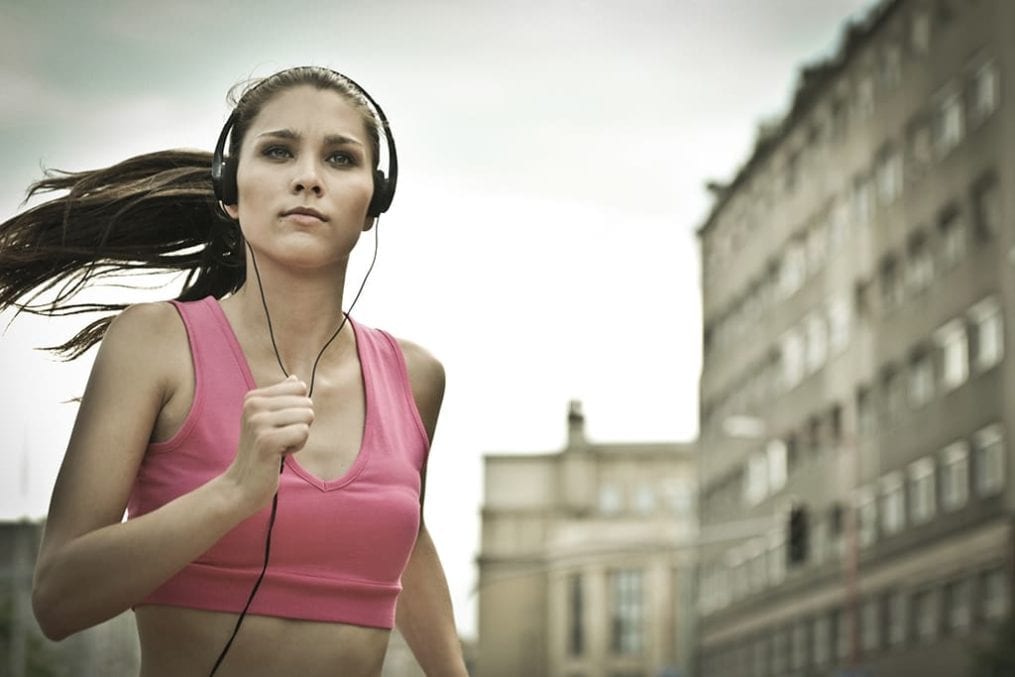 woman running with headphones on