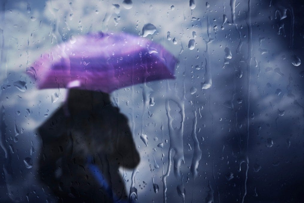 Woman with umbrella in rain