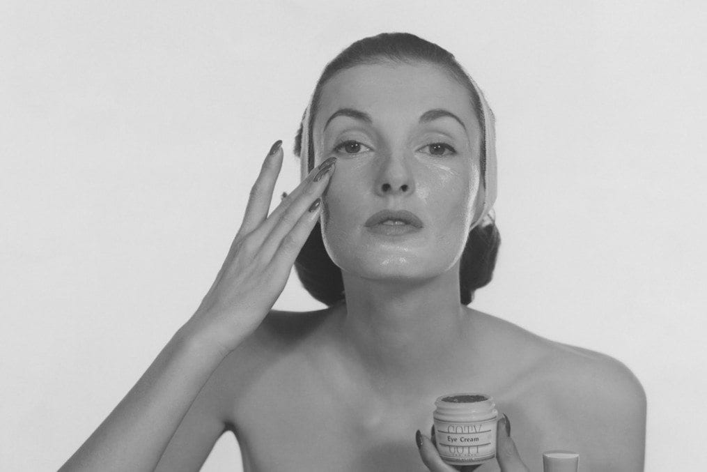 woman applying face cream