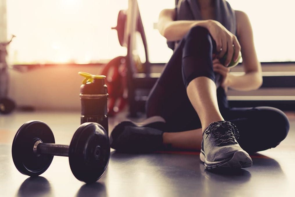 Woman resting at the gym