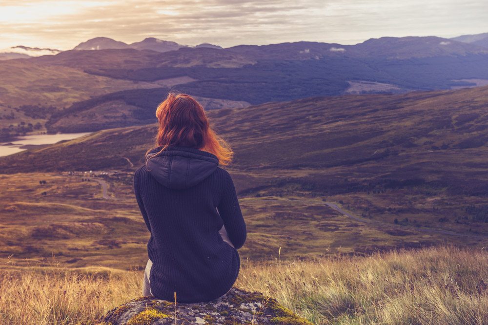 woman looking at lovely landscape