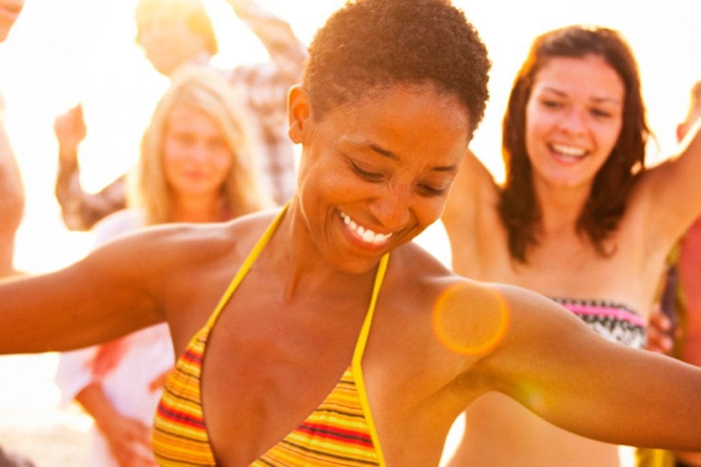 Woman dancing in sunlight