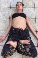 Supta padmasana (reclined or sleeping lotus pose.)