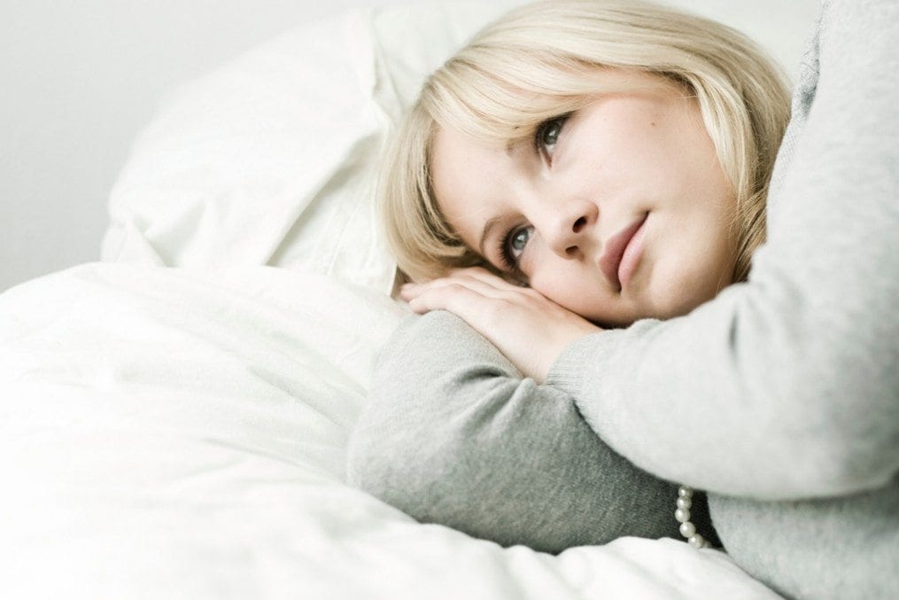 woman lying in bed